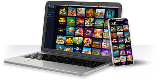 Un ordenador y un móvil con la oferta de juegos de Luna Casino.