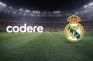 Logos de Codere y Real Madrid sobre un estadio de fútbol.